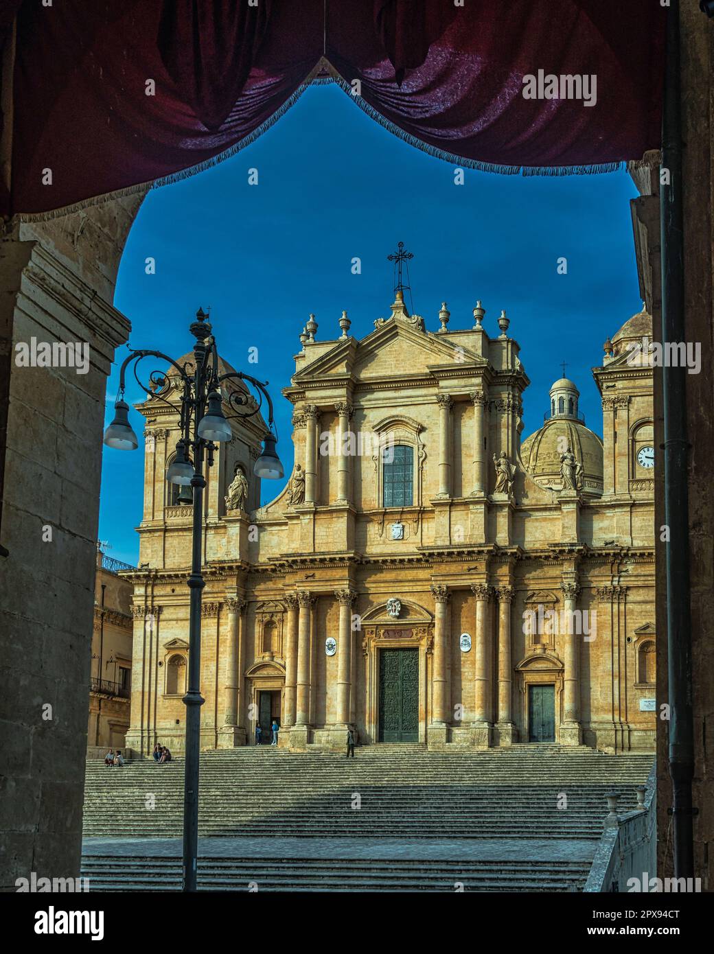 The facade of the Cathedral of San Nicolò, restored in the 18th century in Sicilian Baroque style with a neoclassical dome. Noto, Sicily Stock Photo