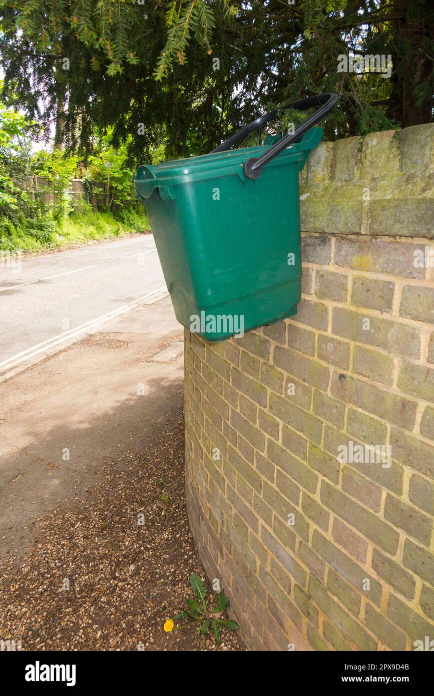 Positioned high up a wall fence and out of reach to deter foxes from