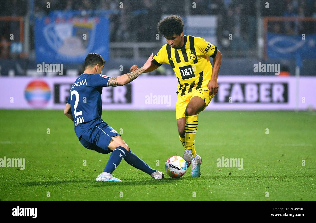 Bundesliga, Vonovia Ruhrstadion Bochum: VfL Bochum vs Borussia Dortmund; Karim Adeyemi (BVB), Christian Gamboa (BOC) Stock Photo
