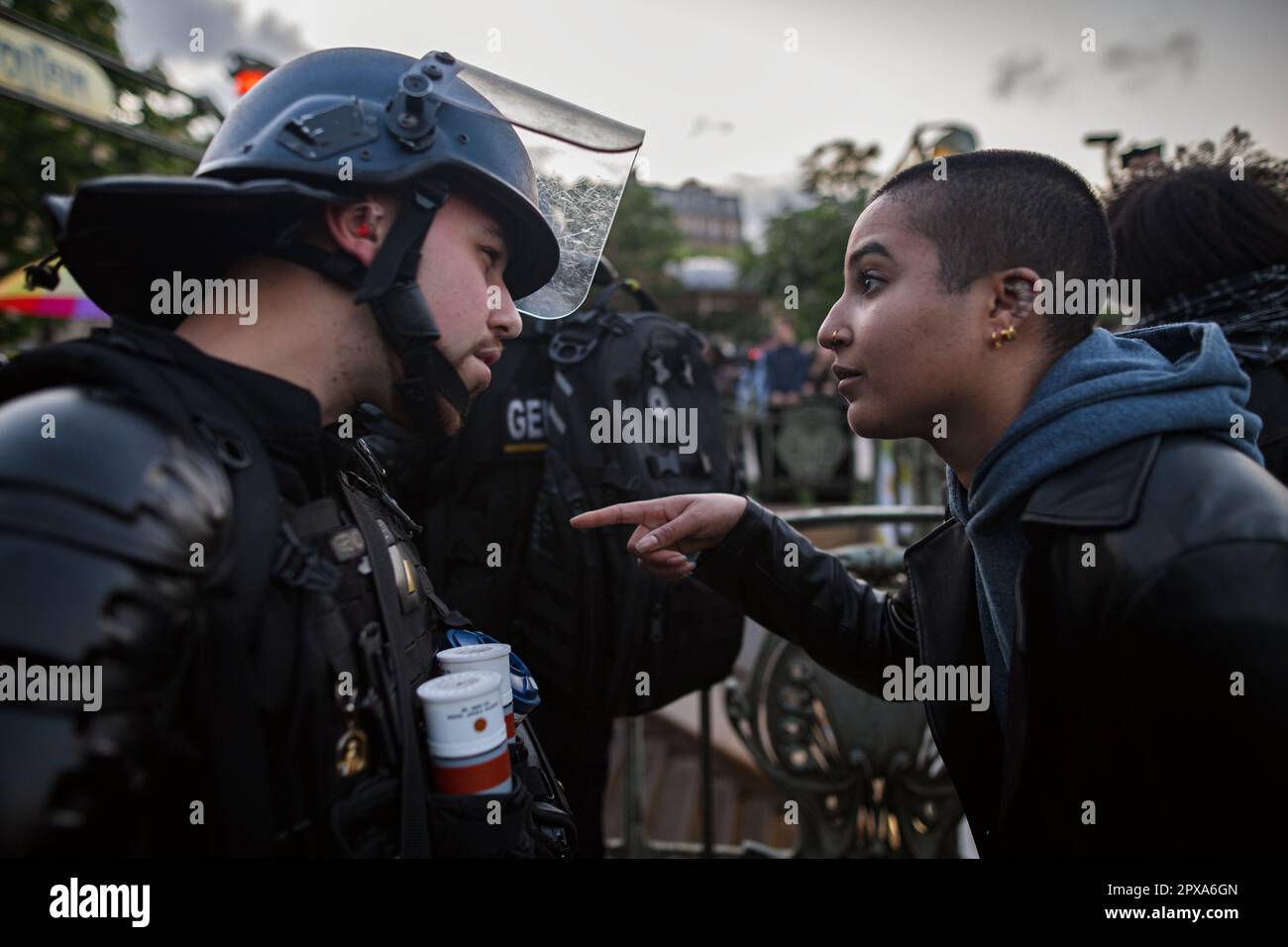 Paris, France. 1st May, 2023. Police officers push the rest of the