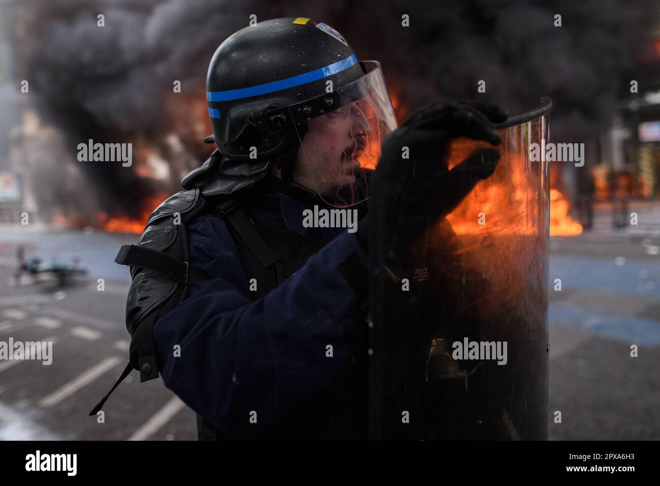 Paris, France. 1st May, 2023. A burning building on the Place de la