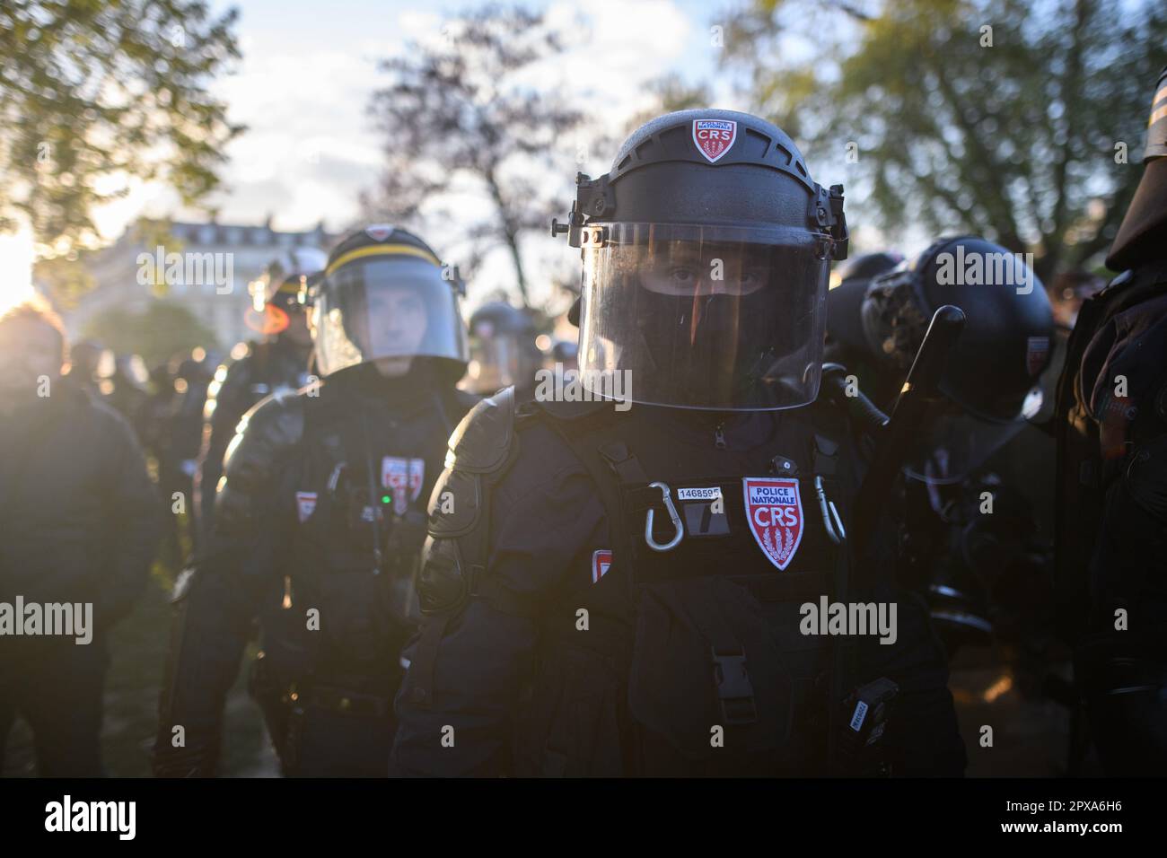 Paris, France. 1st May, 2023. Police officers push the rest of the