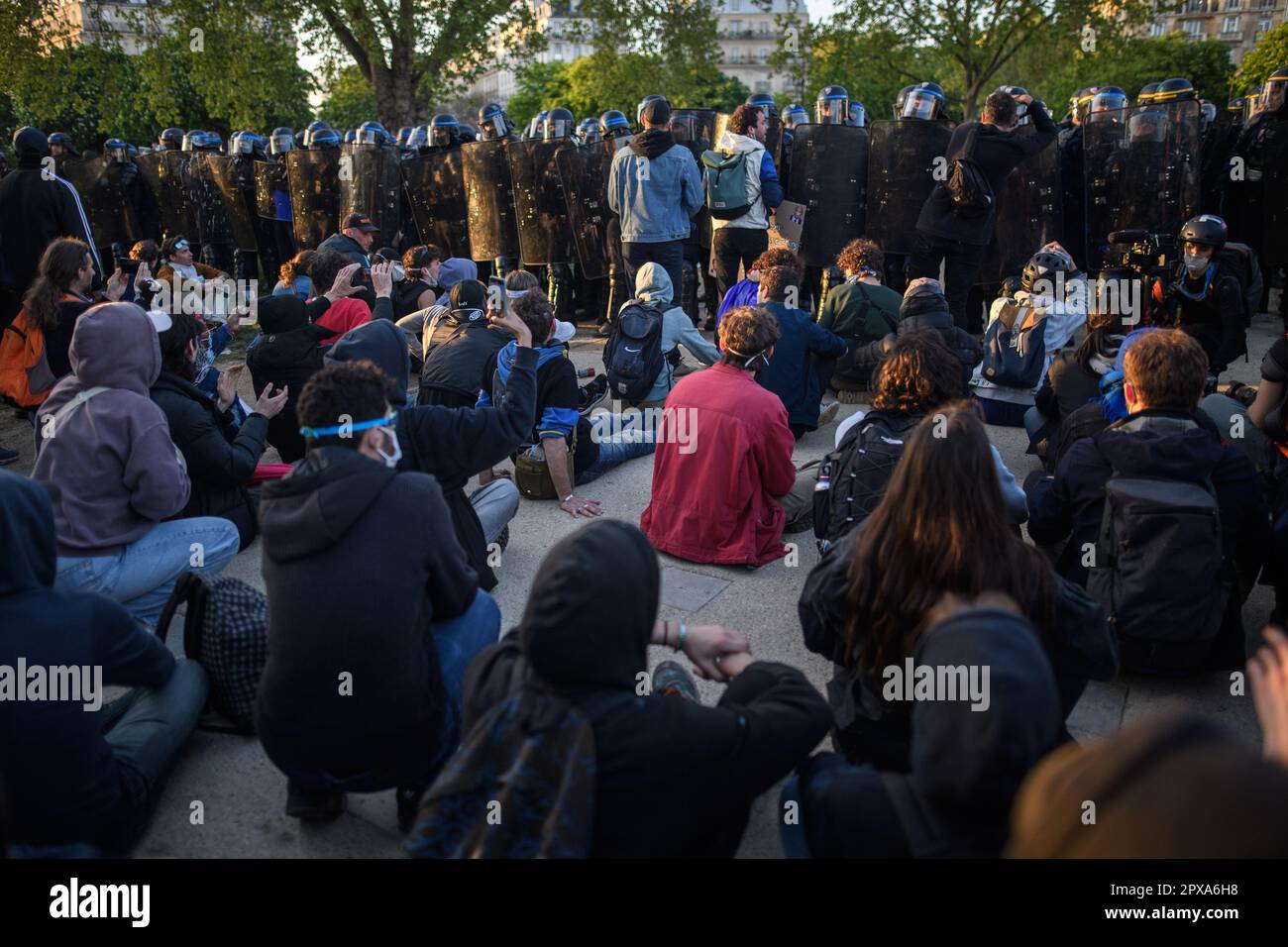 Paris, France. 1st May, 2023. Police officers push the rest of the