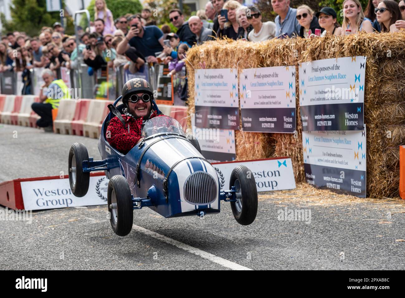 Mind in West Essex charity team cart competing in the Great Dunmow soapbox race 2023, Essex, UK. Taking the jump ramp Stock Photo