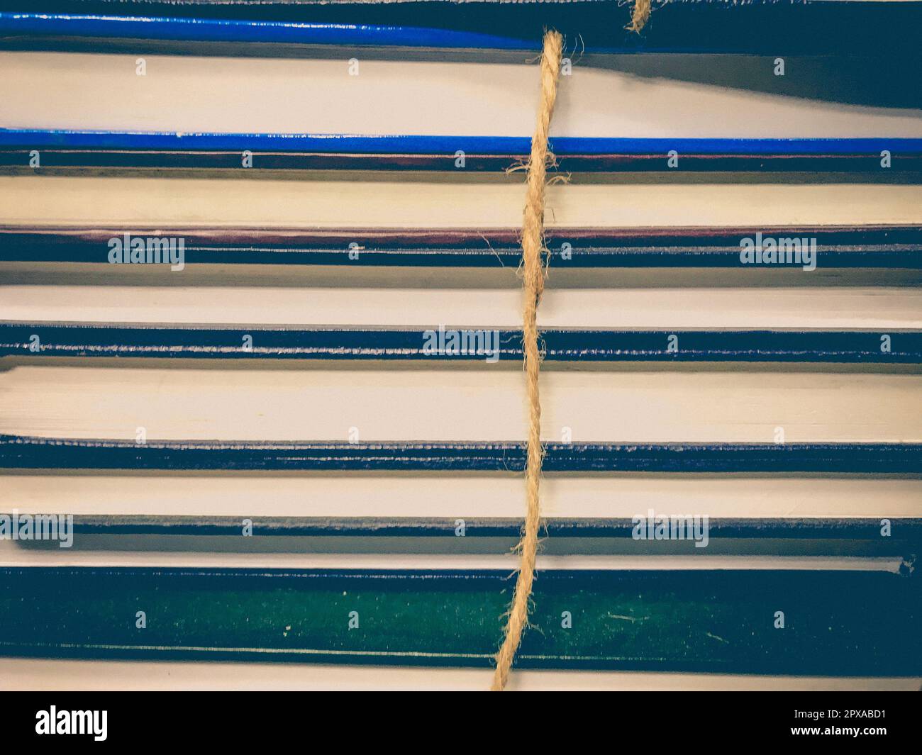 Pile of old books with rope background Stock Photo