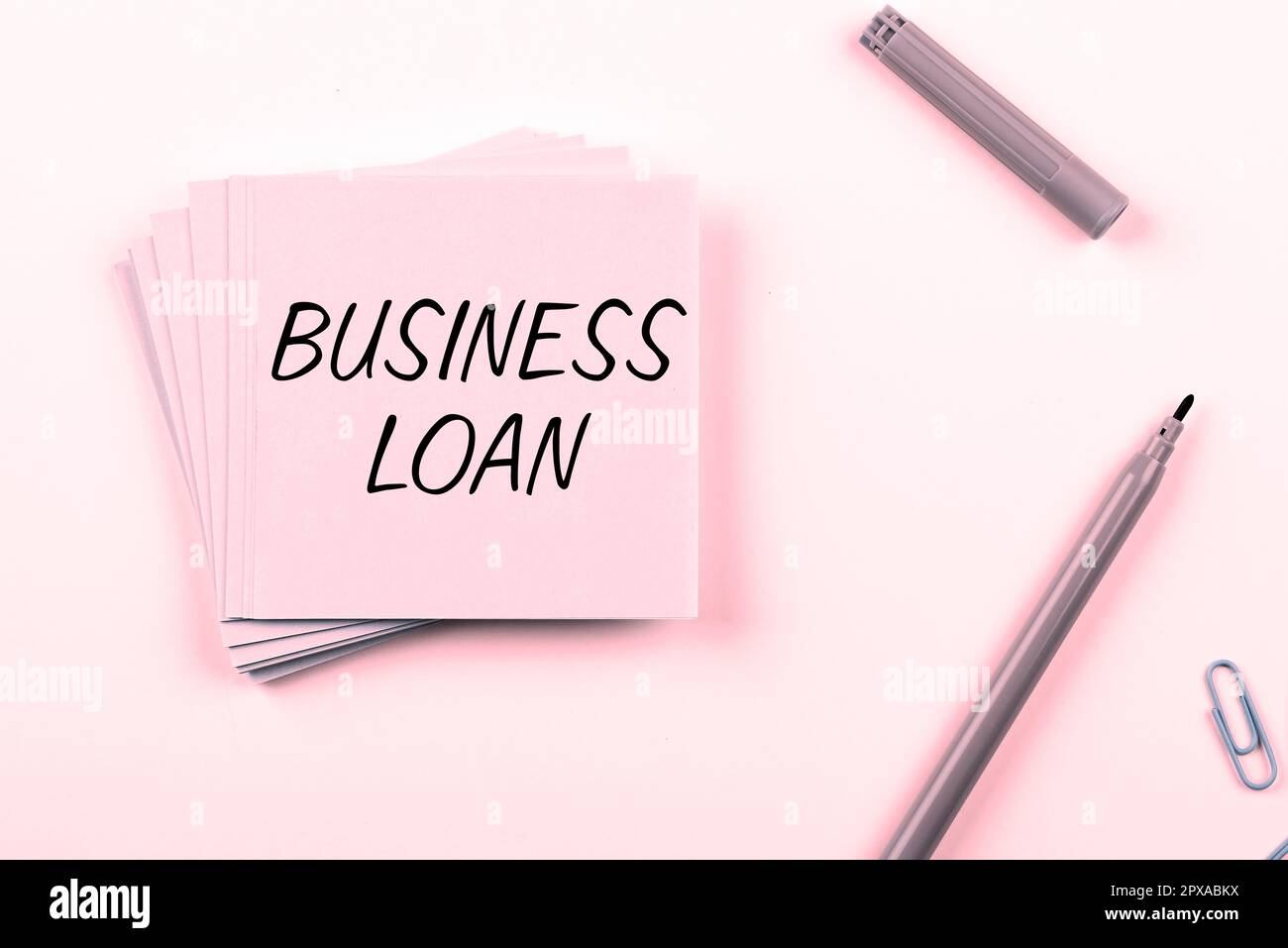 Conceptual caption Business Loan, Word Written on Credit Mortgage Financial Assistance Cash Advances Debt Stock Photo