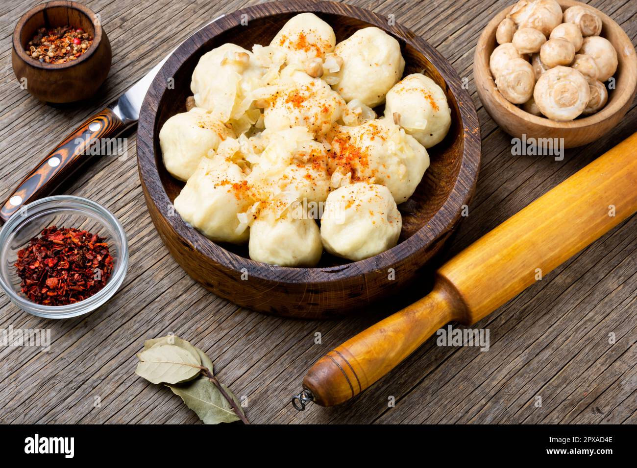 Knedliki, made from dough, potatoes with mushroom filling. Czech cuisine, rustic style Stock Photo