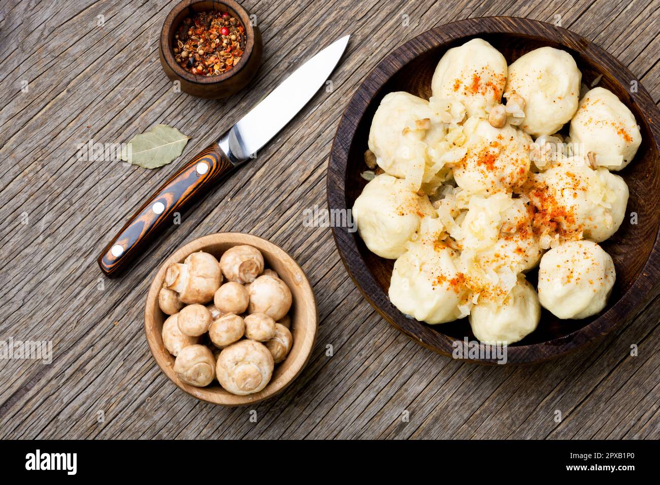 Uncooked knedliks, made from dough, potatoes with mushroom filling. National dish of Czech and Slovak cuisine Stock Photo