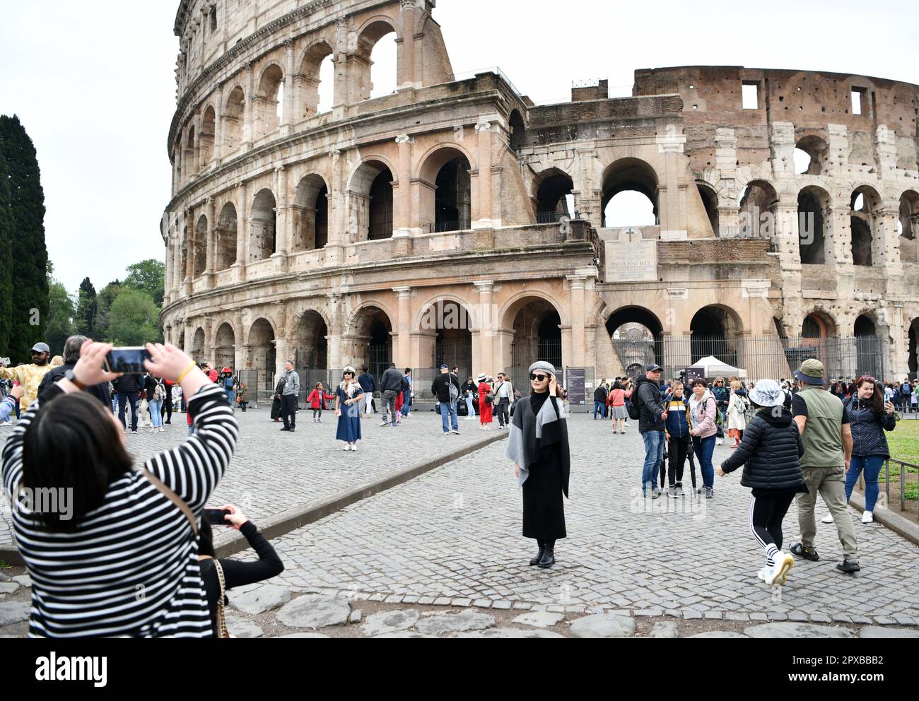 Beijing, Italy. 1st May, 2023. A Chinese tourist poses for photos at
