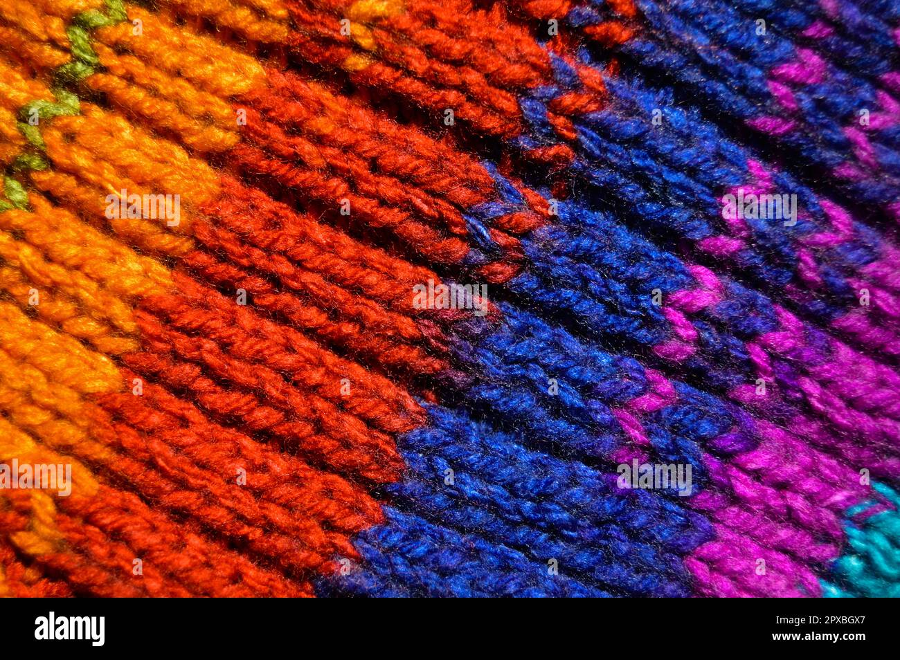 Pattern fabric made of wool. Handmade knitted fabric colored wool ...