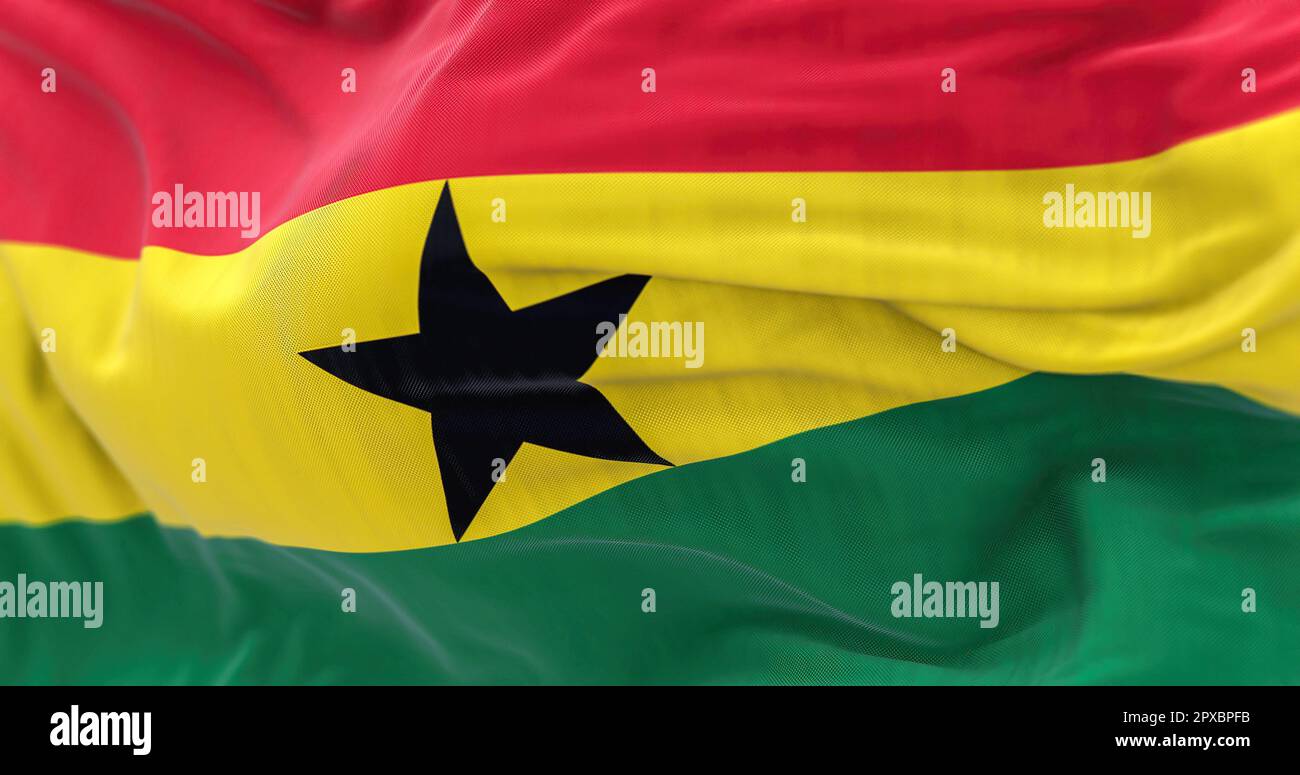 Closeup view of Ghana National flag waving. Red, yellow, green stripes, black star in center