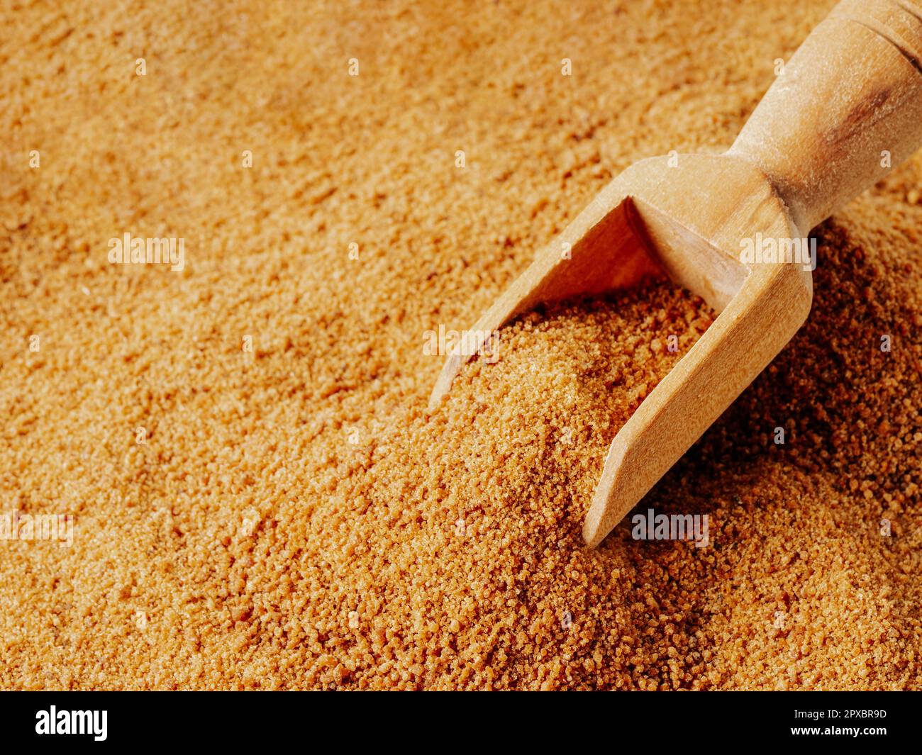 Background texture of raw organic coconut sugar from crystallized sap of cut flower buds coconut