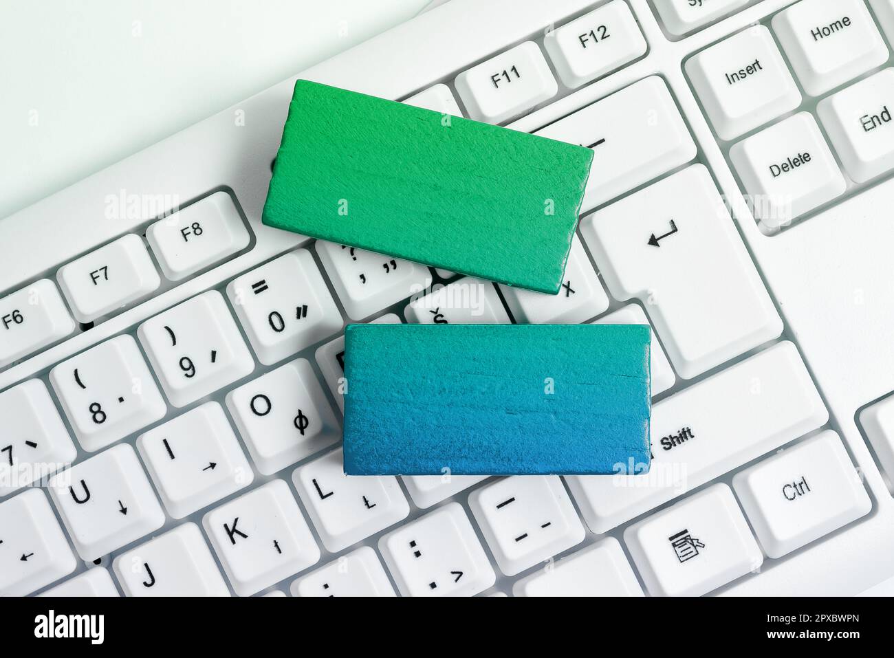 Colored cube with important message lying on keyboard. Main information. Stock Photo