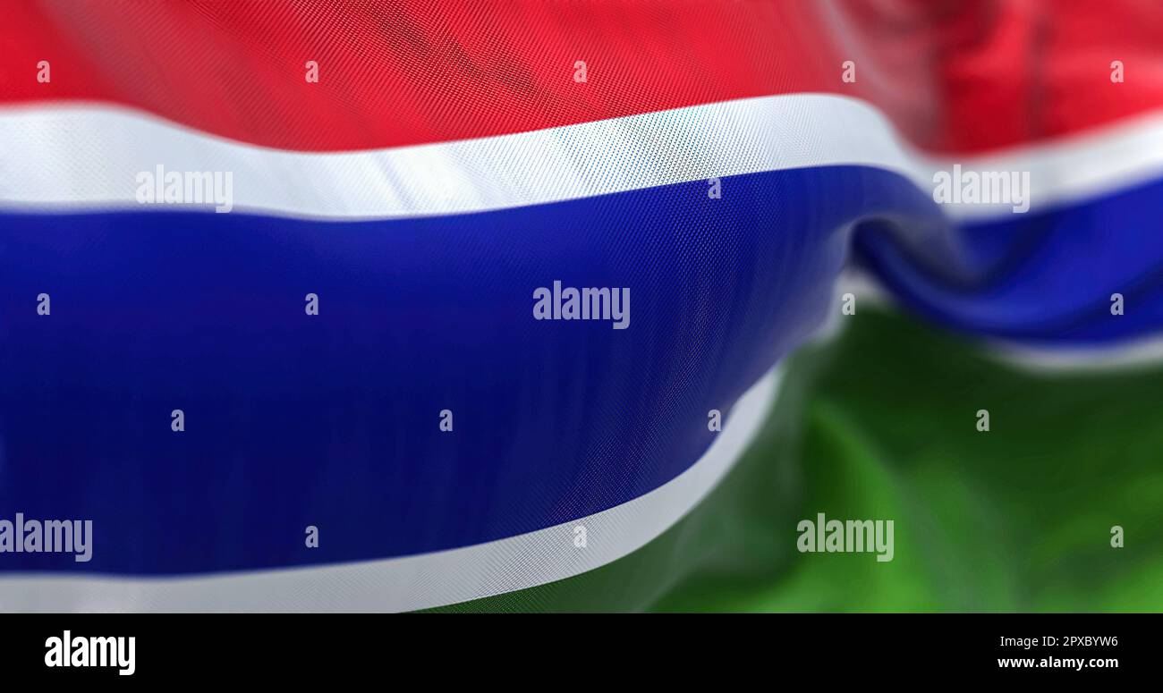 Perspective view of the Gambia national flag waving. Horizontal red