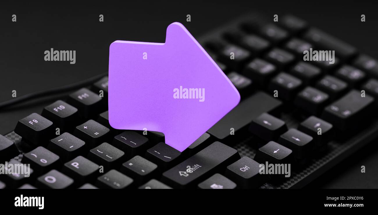 Sticker lying on black keyboard. Important message written over paper ...