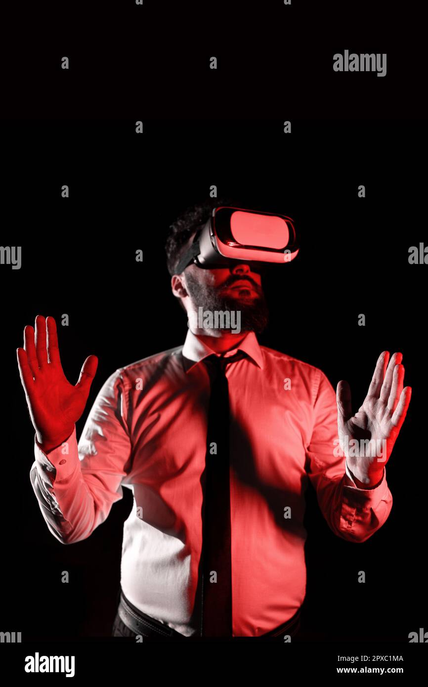 Man Wearing Vr Glasses And Presenting Important Messages Between Hands. Stock Photo