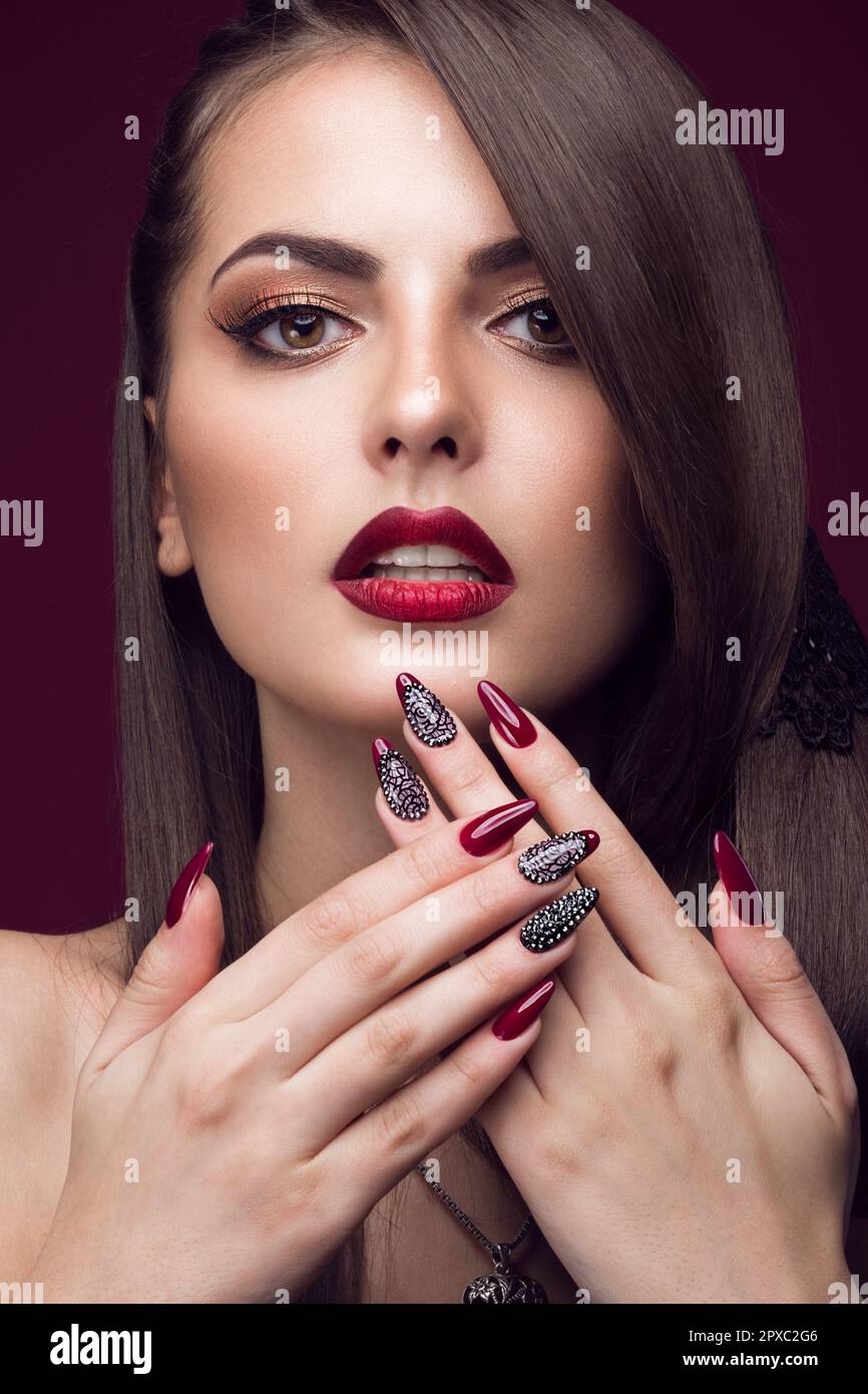 Pretty girl with unusual hairstyle, bright makeup, red lips and