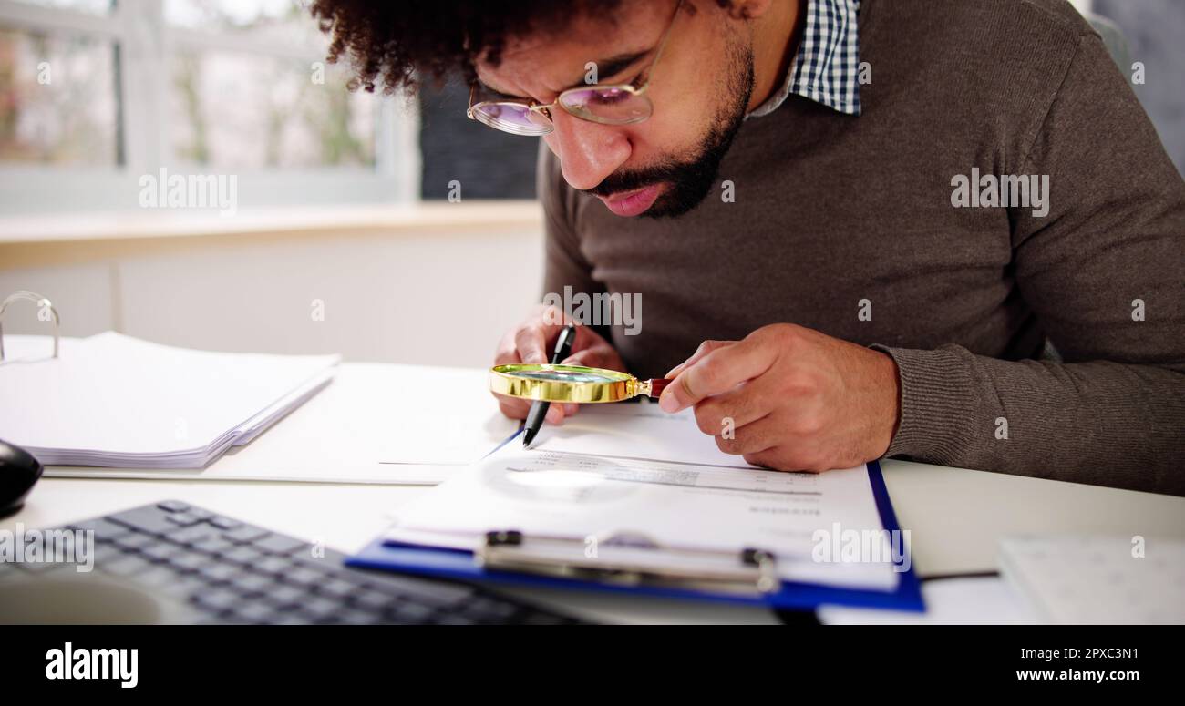 IRS Tax Audit. African Auditor Doing Debt Fraud Inspection Stock Photo ...