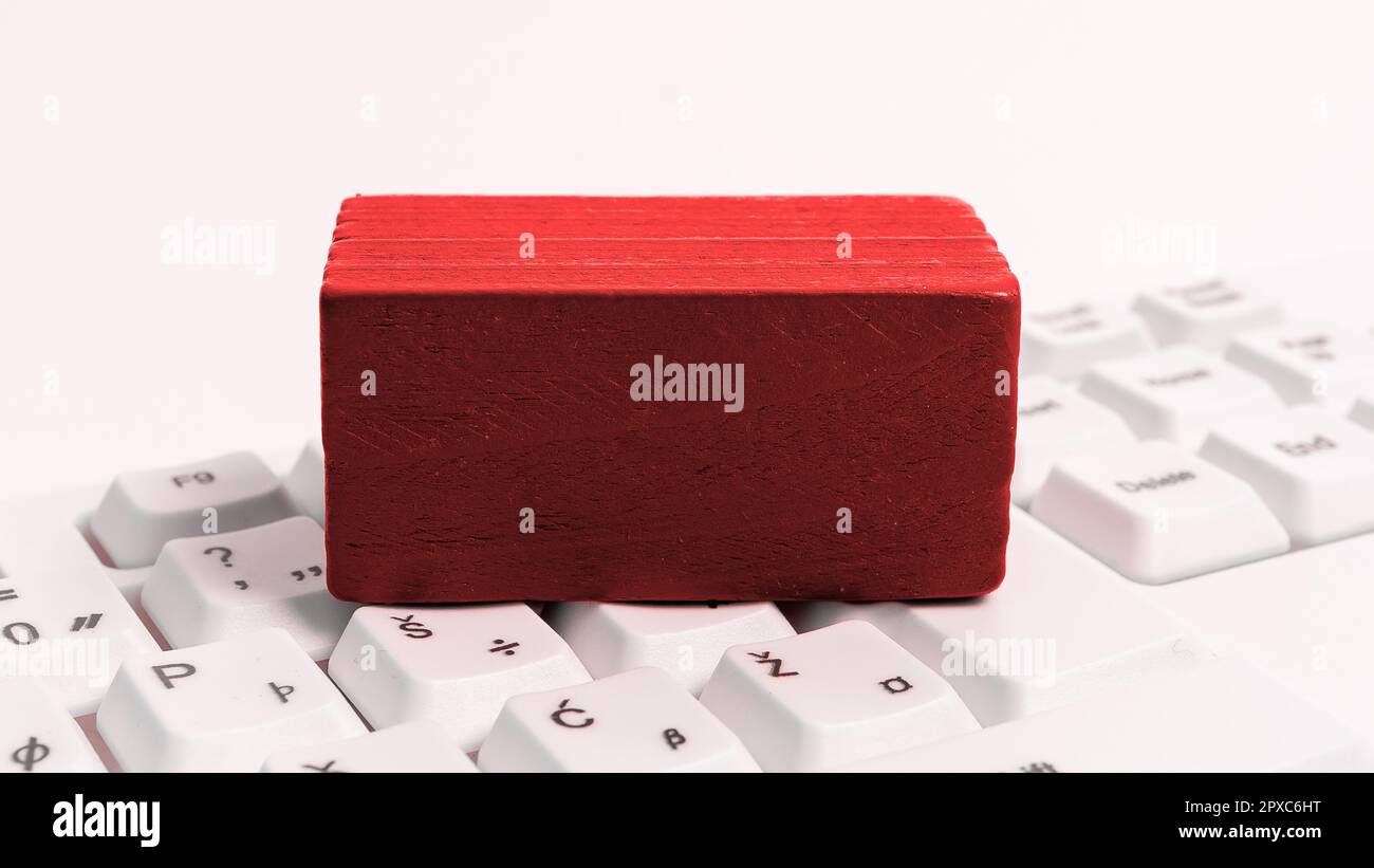 Colored cube with important message lying on keyboard. Main information. Stock Photo