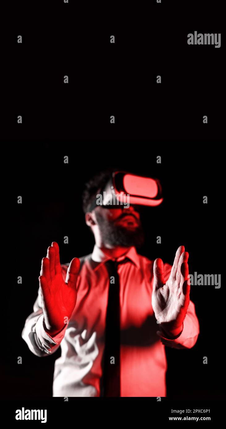 Man Wearing Vr Glasses And Presenting Important Messages Between Hands. Stock Photo