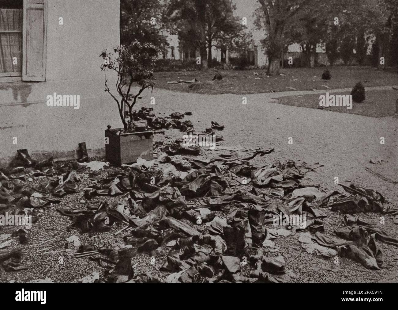 World War I. France at war. 1914 An enemy ambulance was installed at the French castle; the men who died there were buried in the park. Their boots and their soiled belongings litter the floor. Stock Photo