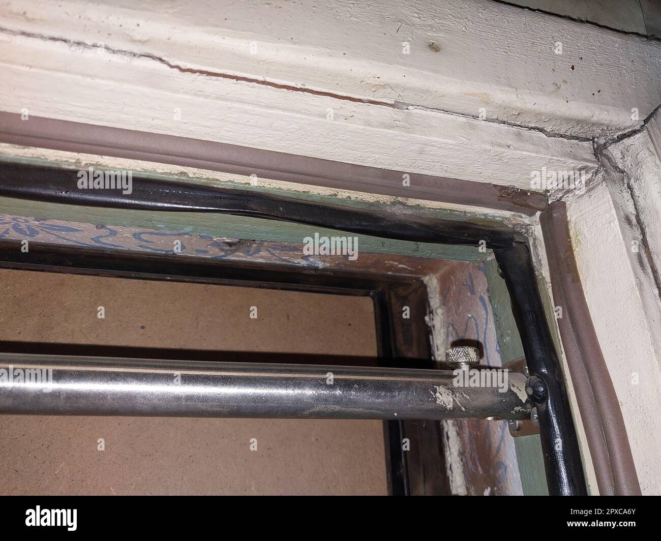 Installing a door seal against drafts and the odors Stock Photo Alamy