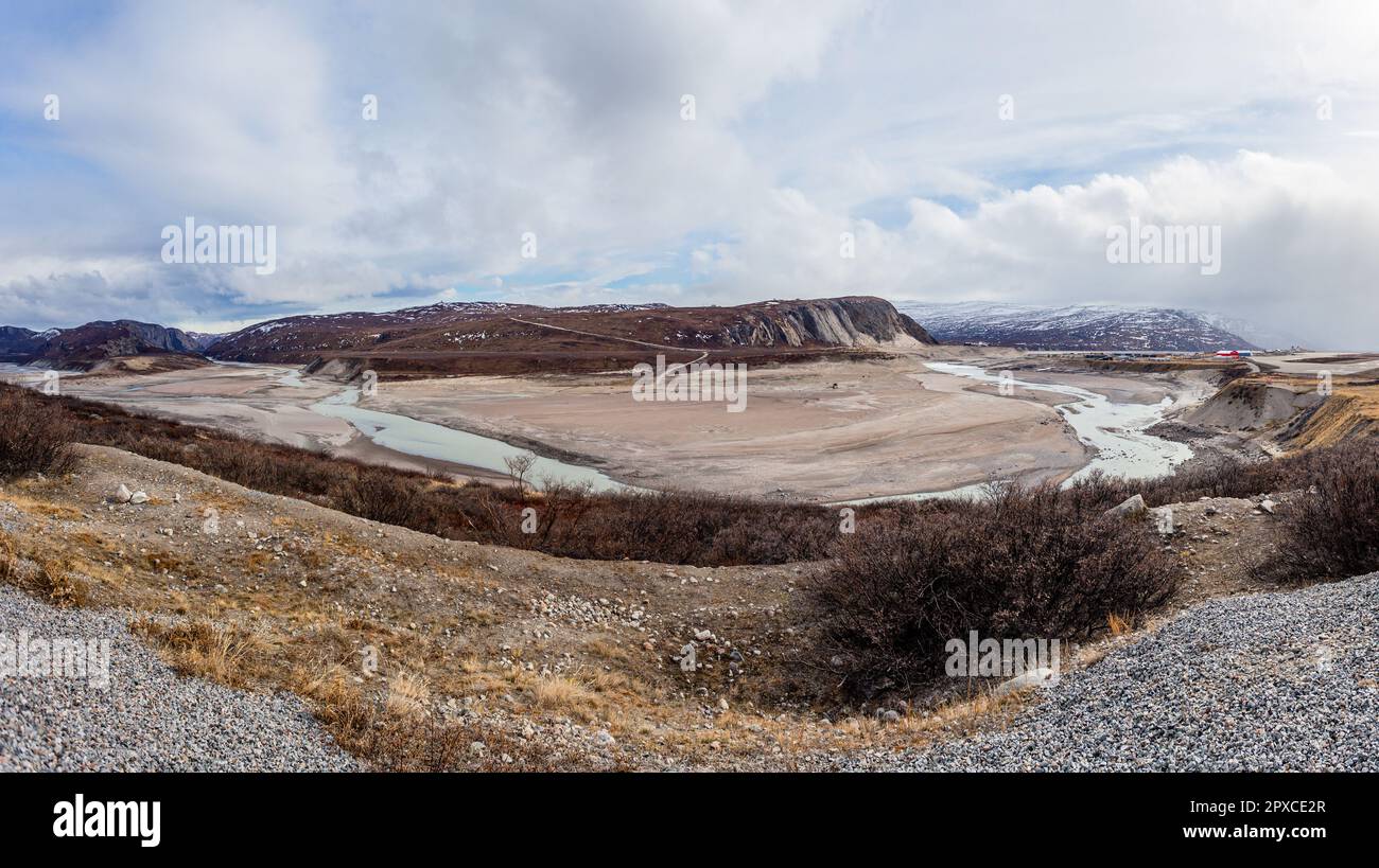 Autumn greenlandic wastelands landscape with river and mountains in the background, Kangerlussuaq, Greenland Stock Photo
