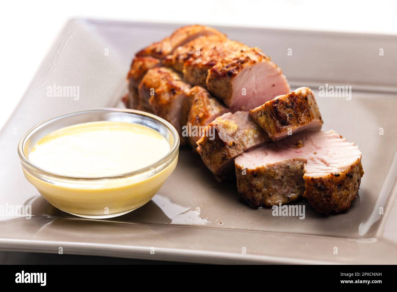 roasted pork loin with mustard sauce Stock Photo Alamy