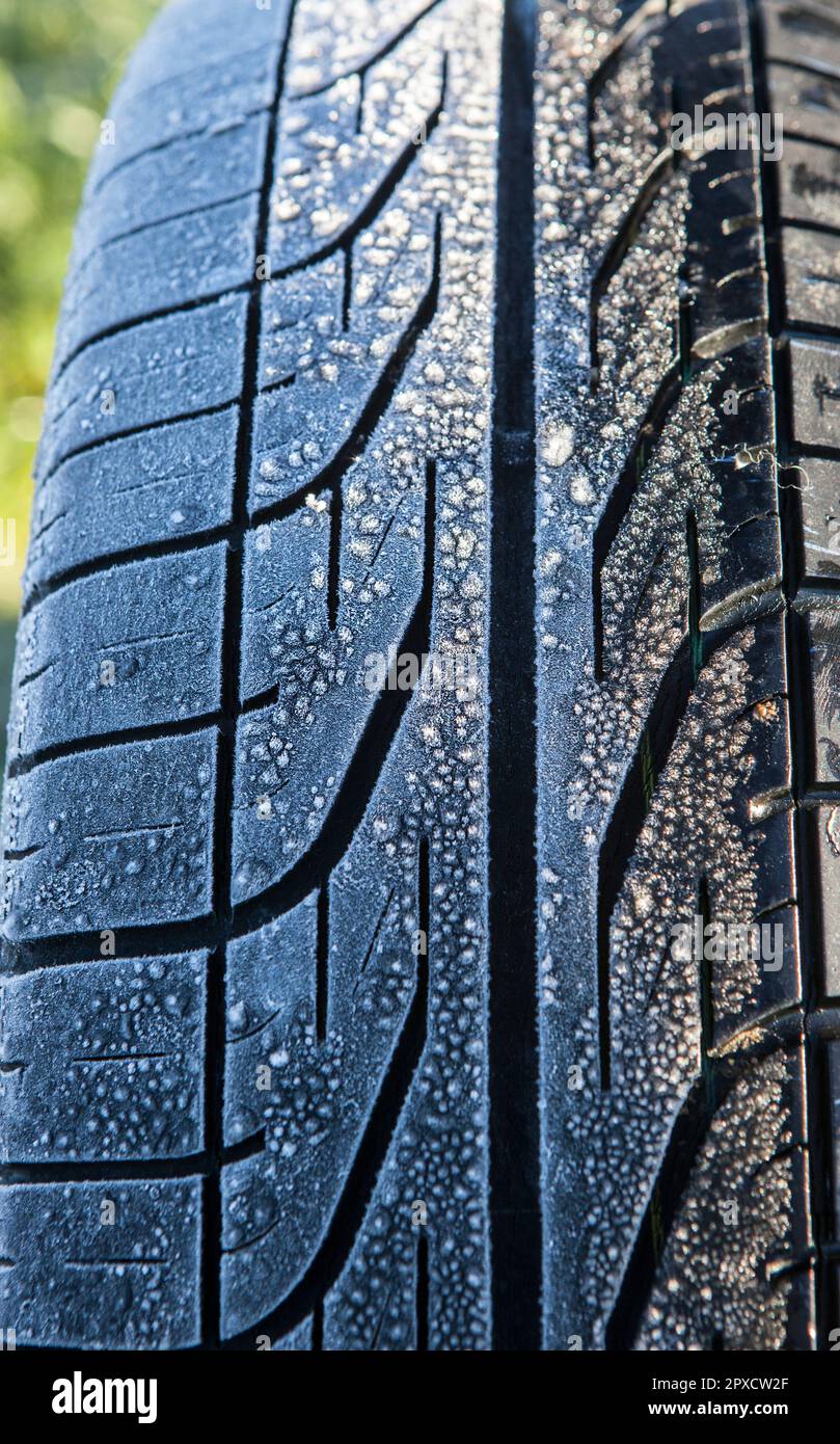 Frost covered tire surface. Safe driving on winter concept Stock Photo