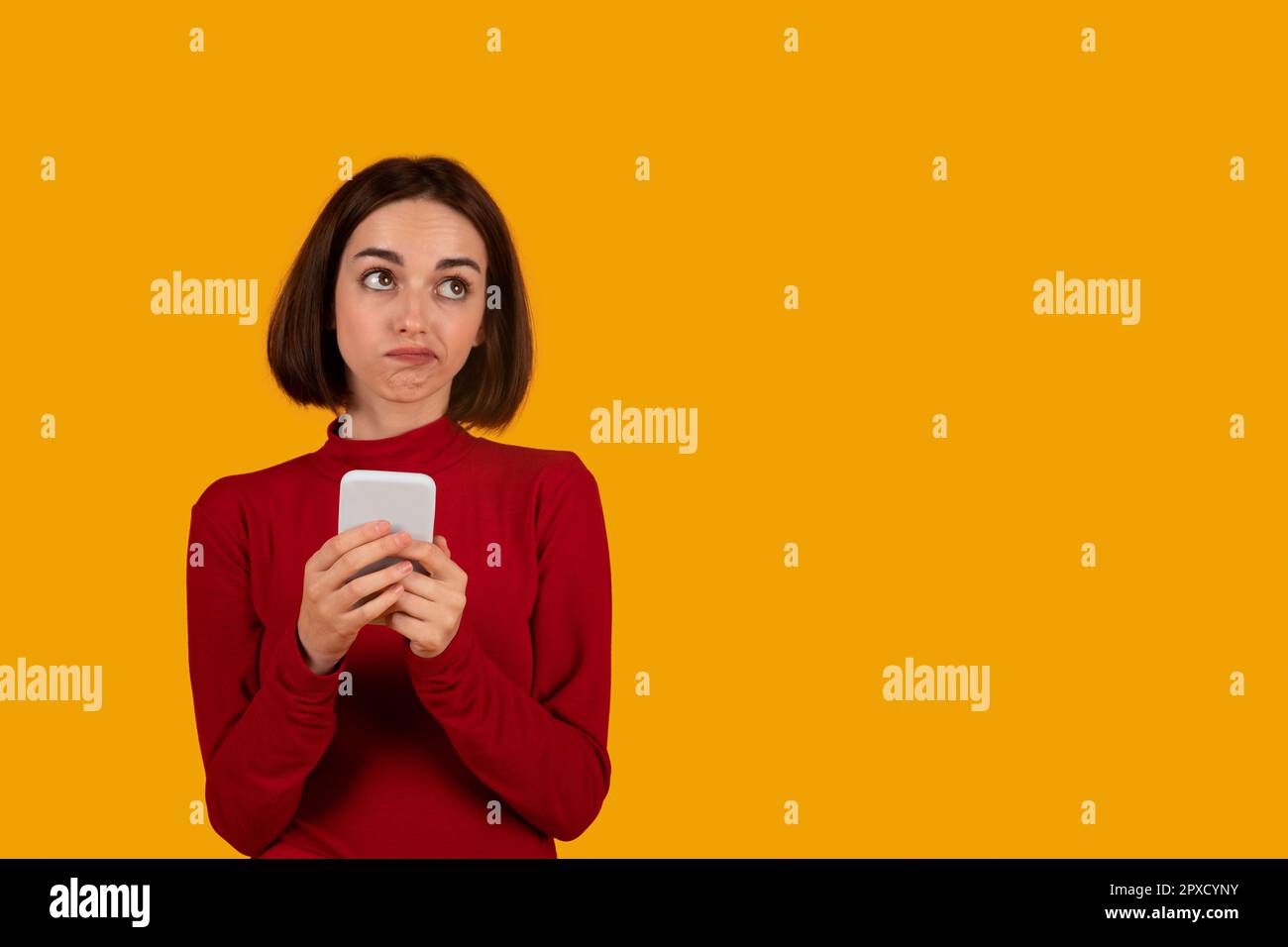Beautiful confused woman using hi-res stock photography and images - Alamy