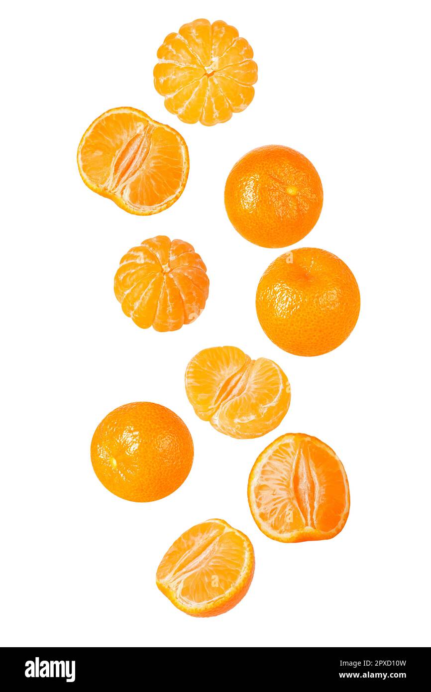 Isolated flying grapes. Nine whole and sliced mandarin fruits falling