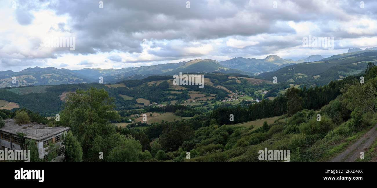 Rustic mountain landscape with cloudy sky.Bien Aparecida, Cantabria ...