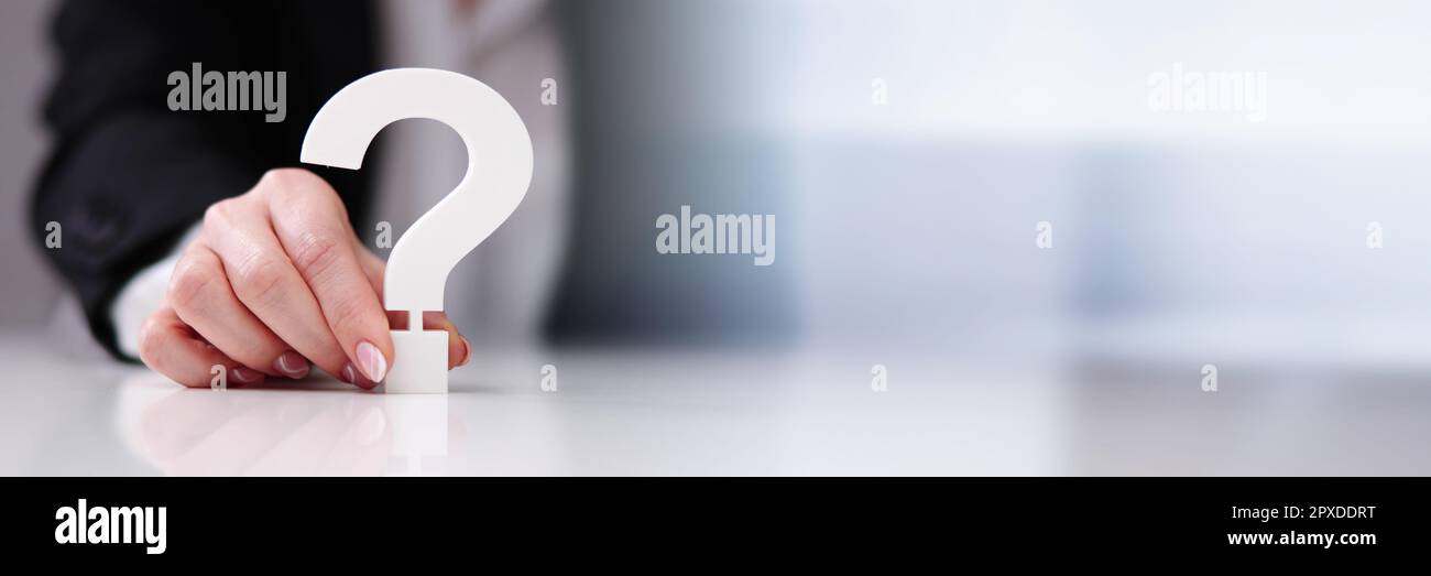 Businessperson's Hand Holding Red Question Mark Sign Stock Photo - Alamy