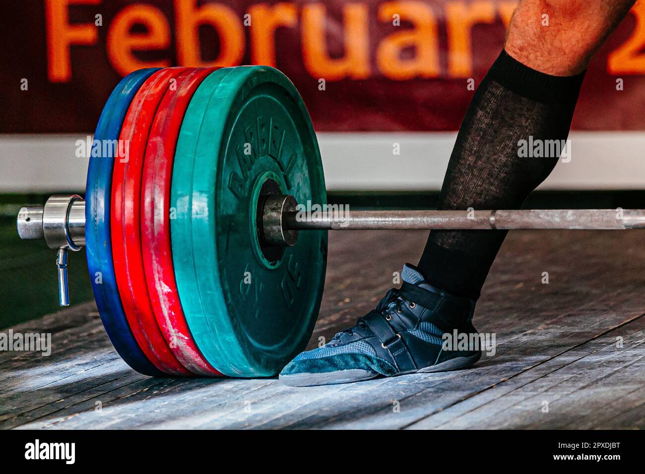 deadlift in powerlifting competition, legs athlete powerlifter and barbell with plates Stock