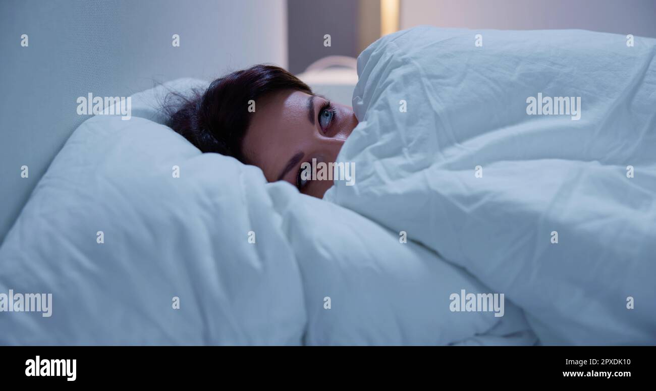 Awake Sleepless Woman Afraid And Scared At Night Stock Photo Alamy