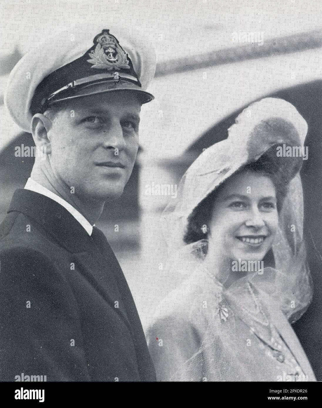 Photograph of a relaxed looking Duke of Edinburgh. and  Princess Elizabeth who is smiling for camera, on board a motor launch on the Seine during their state visit to Paris 15 May 1948. Stock Photo