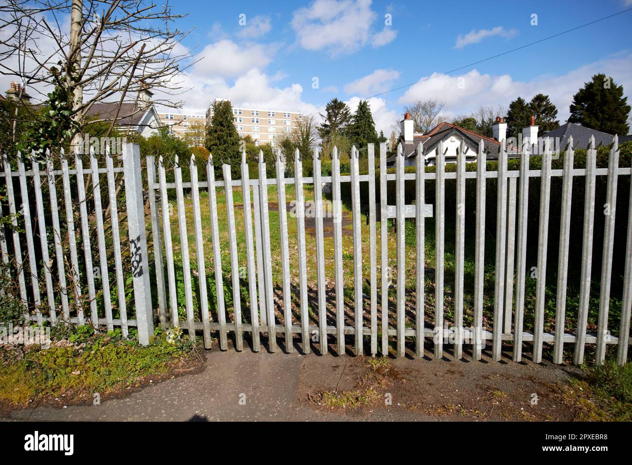 strong metal security railings and gate around prime residential land plot for sale in balmoral bt9 south belfast northern ireland uk Stock Photo