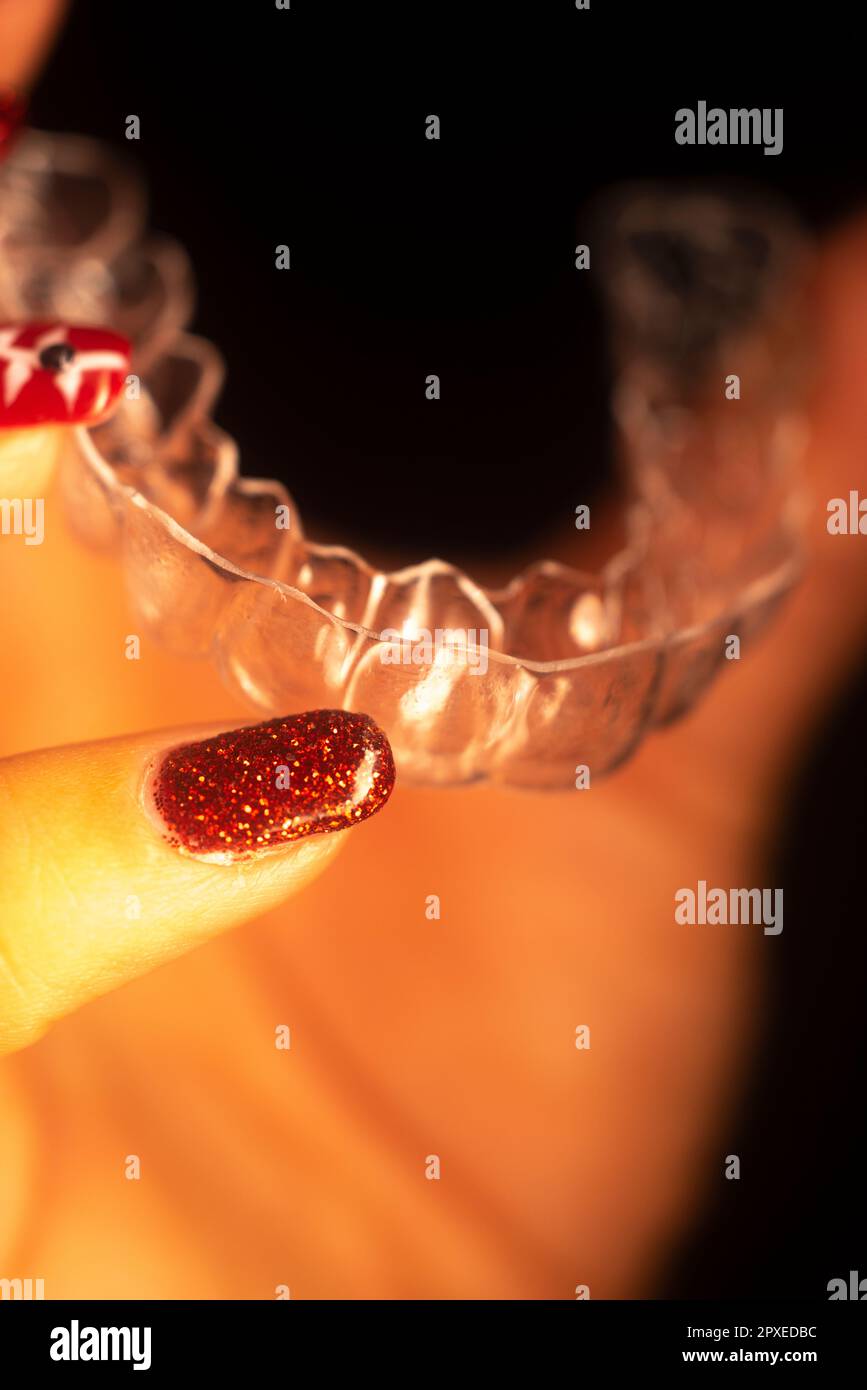 Invisible dental tooth bracket aligners to straighten teeth Stock Photo