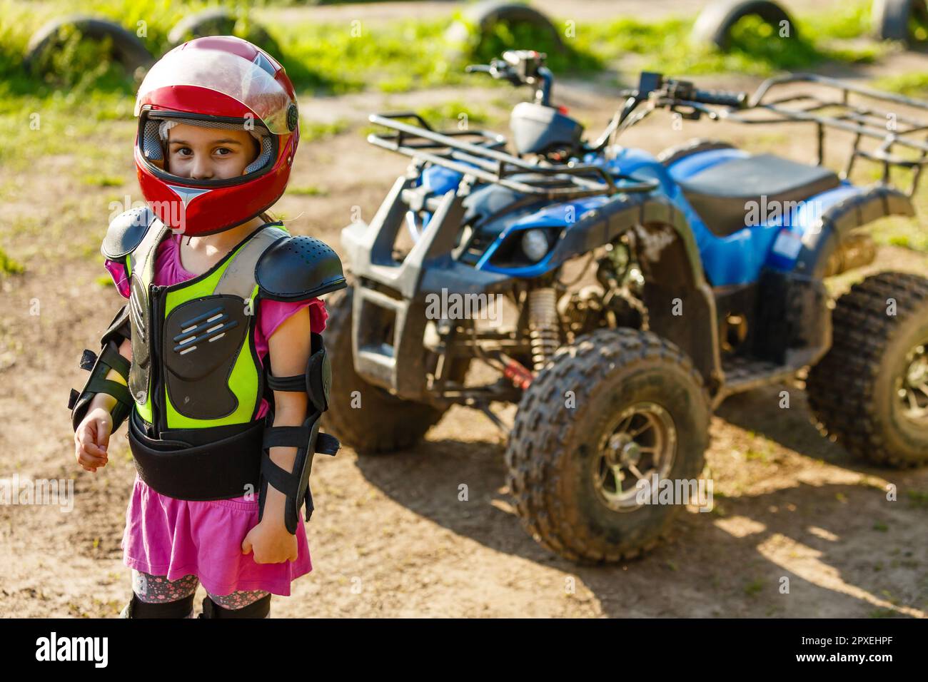 A child rides a quad bike through the mud. ATV rider rides Stock Photo ...