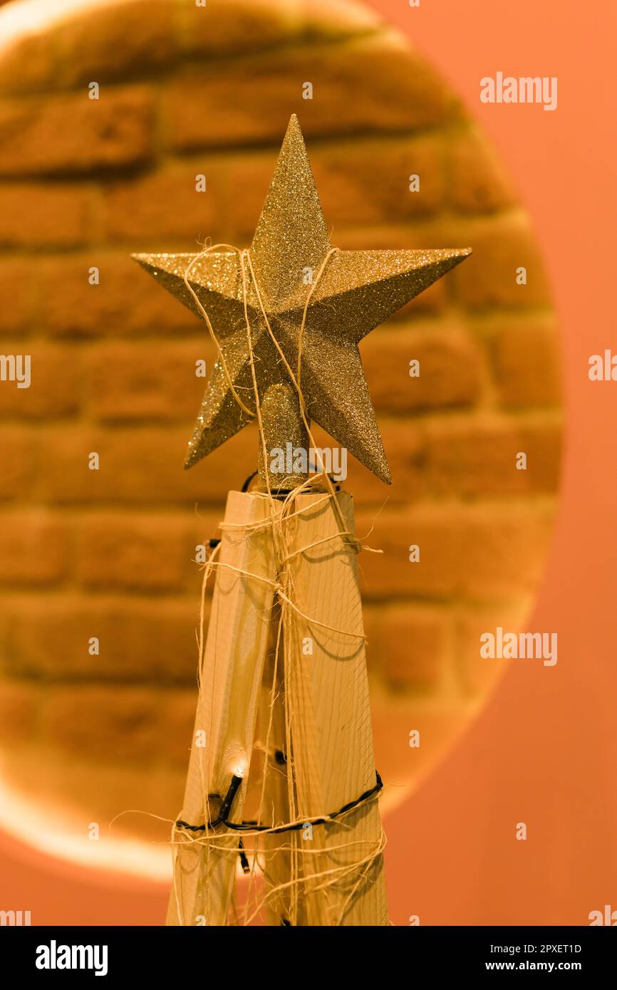 Alternative Christmas tree of raw wood branches decorated with fairy