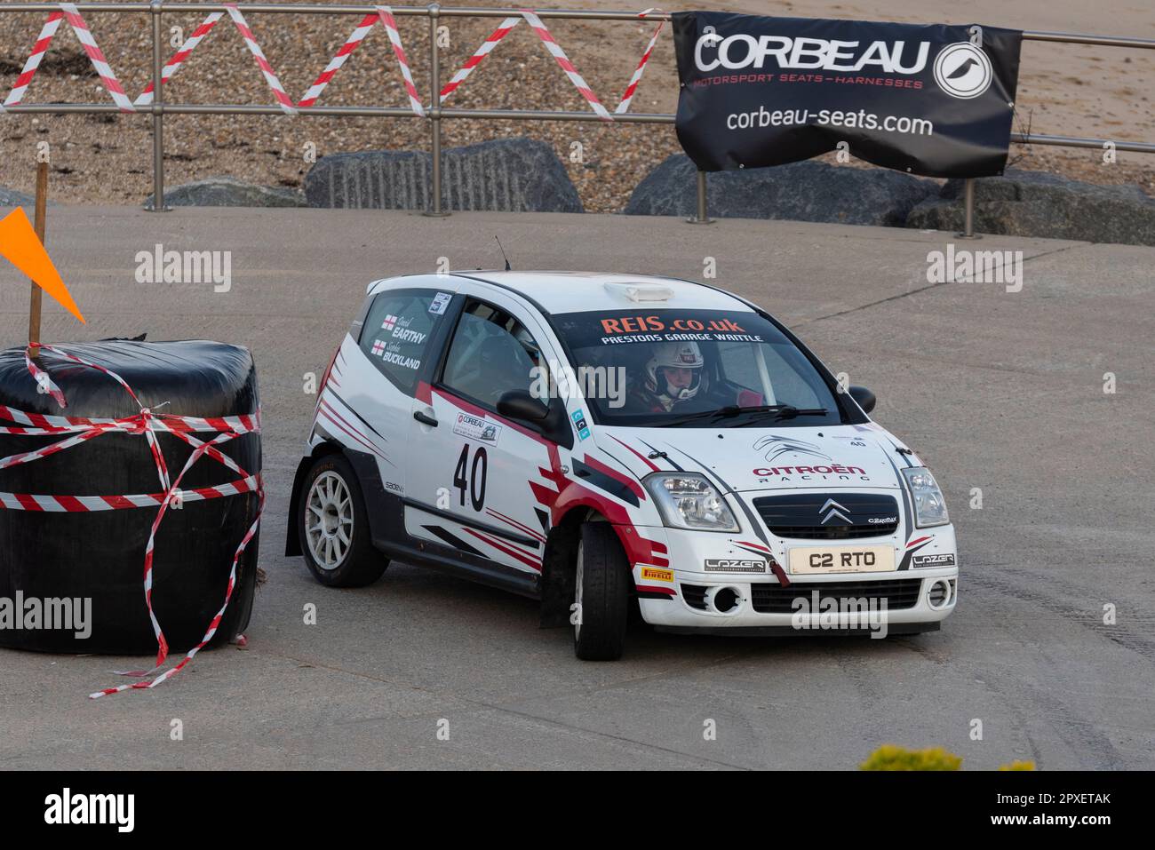 David Earthy racing a Citroen C2 R2 Max competing in the Corbeau Seats rally on the seafront at Clacton, Essex, UK. Co driver Sophie Buckland Stock Photo