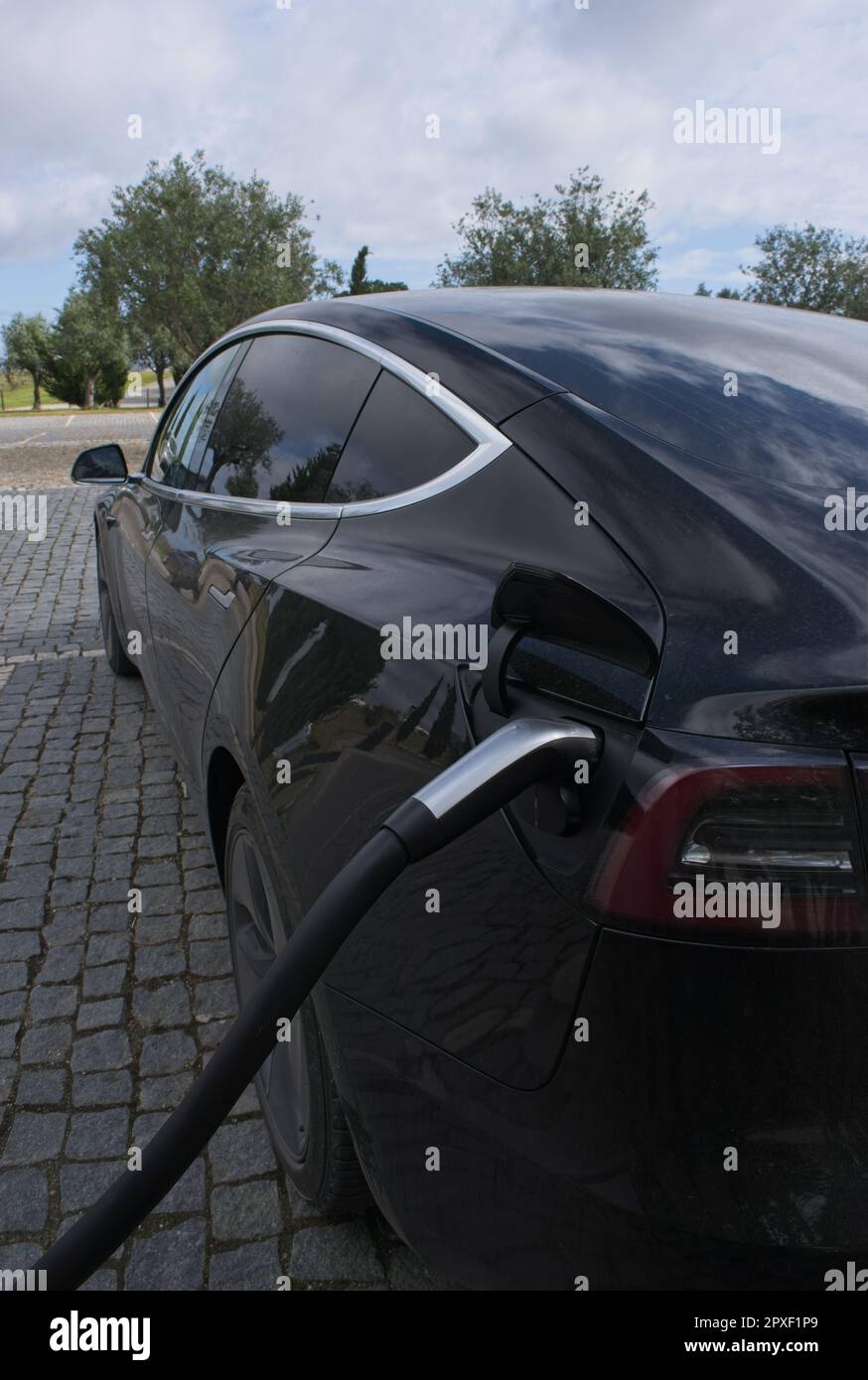 MontemoroNovo, Portugal April 1, 2023 A static shot of a solid black Tesla Model 3 dual