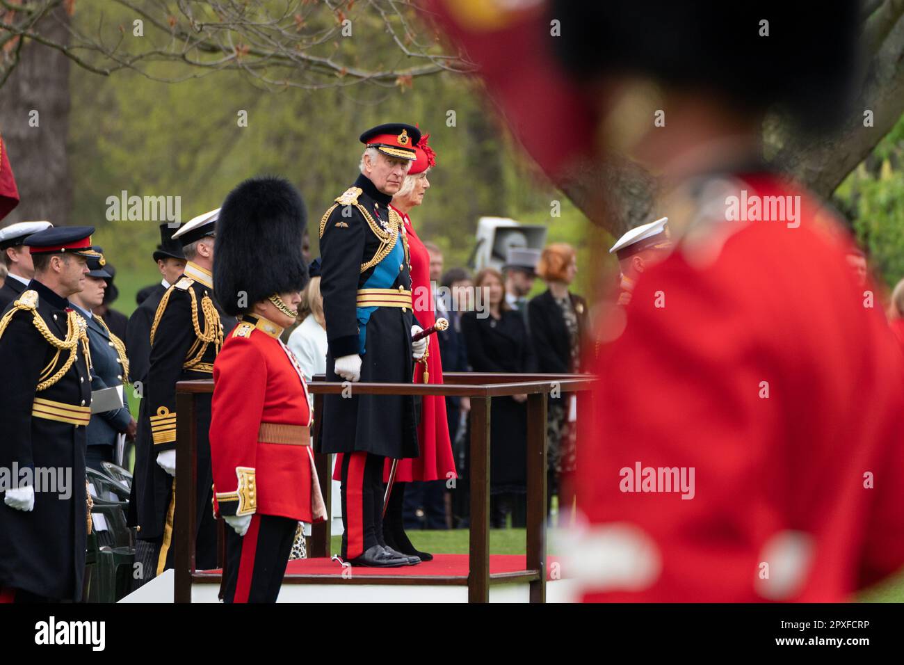 File photo dated 27/04/23 of King Charles III and the Queen Consort attend a ceremony to present new Standards and Colours at Buckingham Palace in London. The King is to host world leaders at Buckingham Palace - and be presented with his own feathered crown - in the days leading up to the coronation. Issue date: Tuesday May 2, 2023. Stock Photo