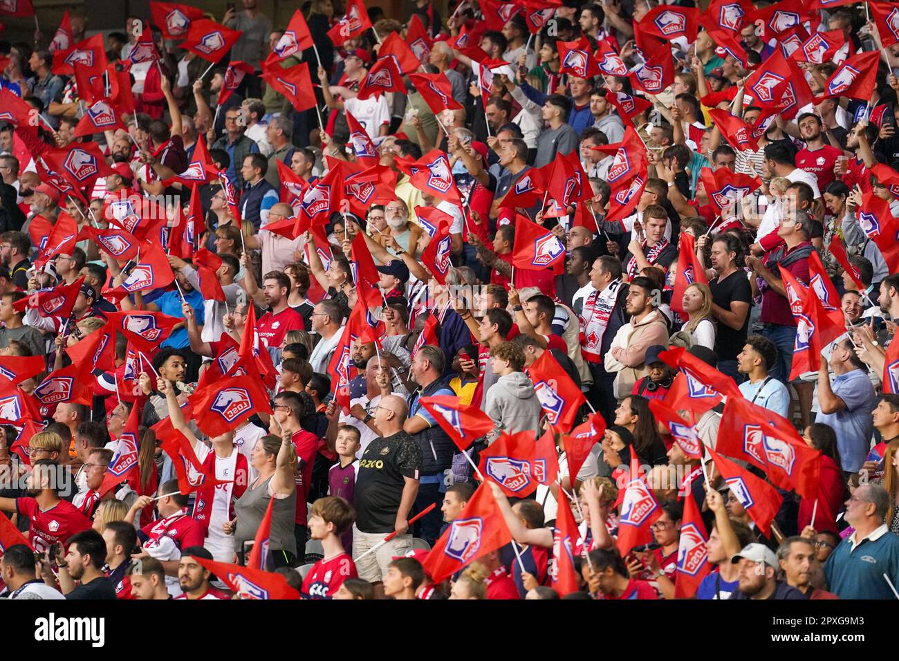 LILLE, FRANCE - AUGUST 21: Fans and supporters of LOSC Lille with flags  prior to the Ligue 1 Uber Eats match between Lille OSC and Paris  Saint-Germain at the Stade Pierre-Mauroy on