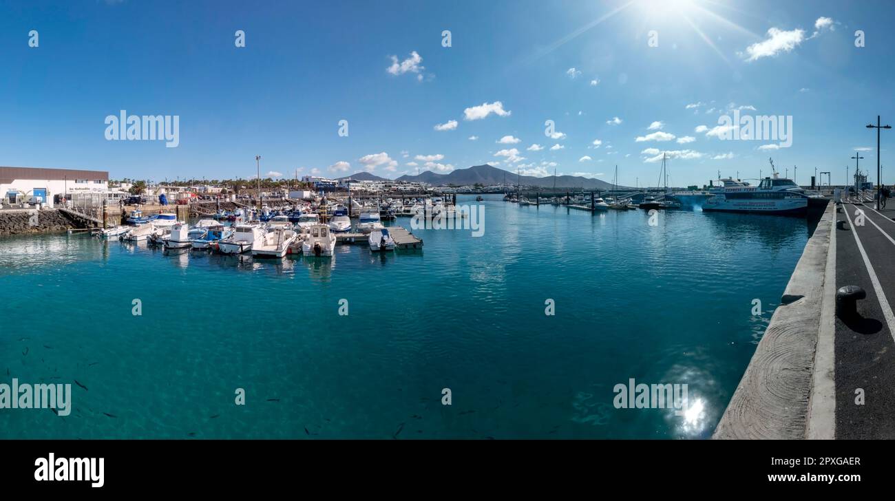 Playa Blanca, Yaiza, Lanzarote, Canary Islands, Spain - April 21, 2023: Panoramic view of the pretty port of Playa Blanca, in Yaiza, Lanzarote island, Stock Photo
