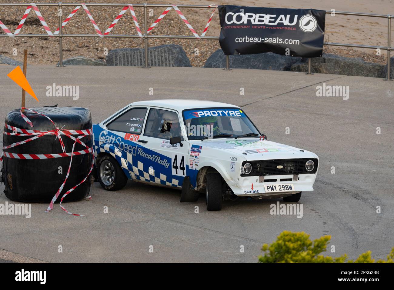 Lewis Gatt racing a classic Ford Escort Mk2 competing in the Corbeau Seats rally on the seafront at Clacton, Essex, UK. Co driver Callum Young Stock Photo