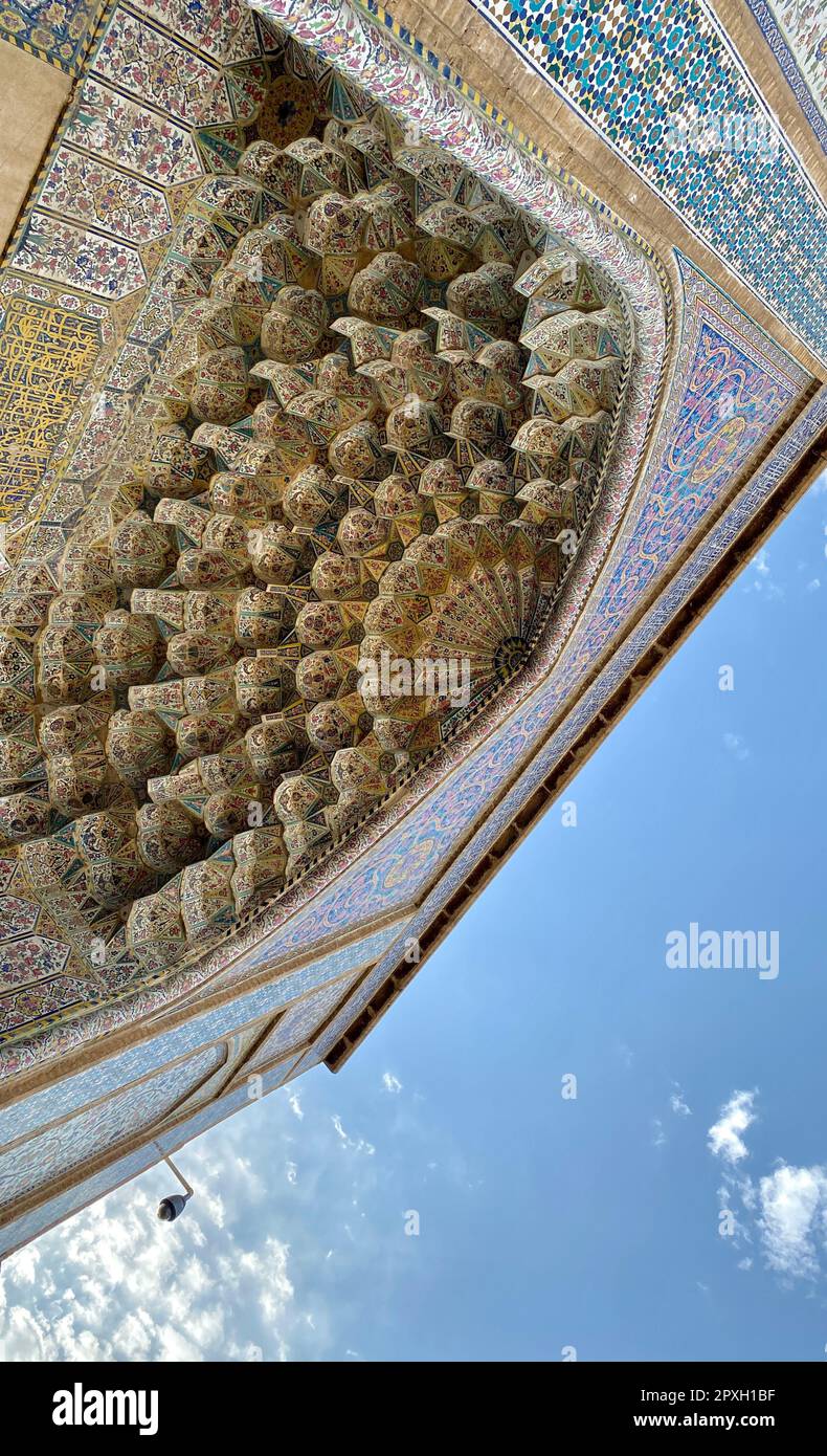 A vertical low angle shot of the historic ornate Wakil Mosque in Shiraz, Iran Stock Photo