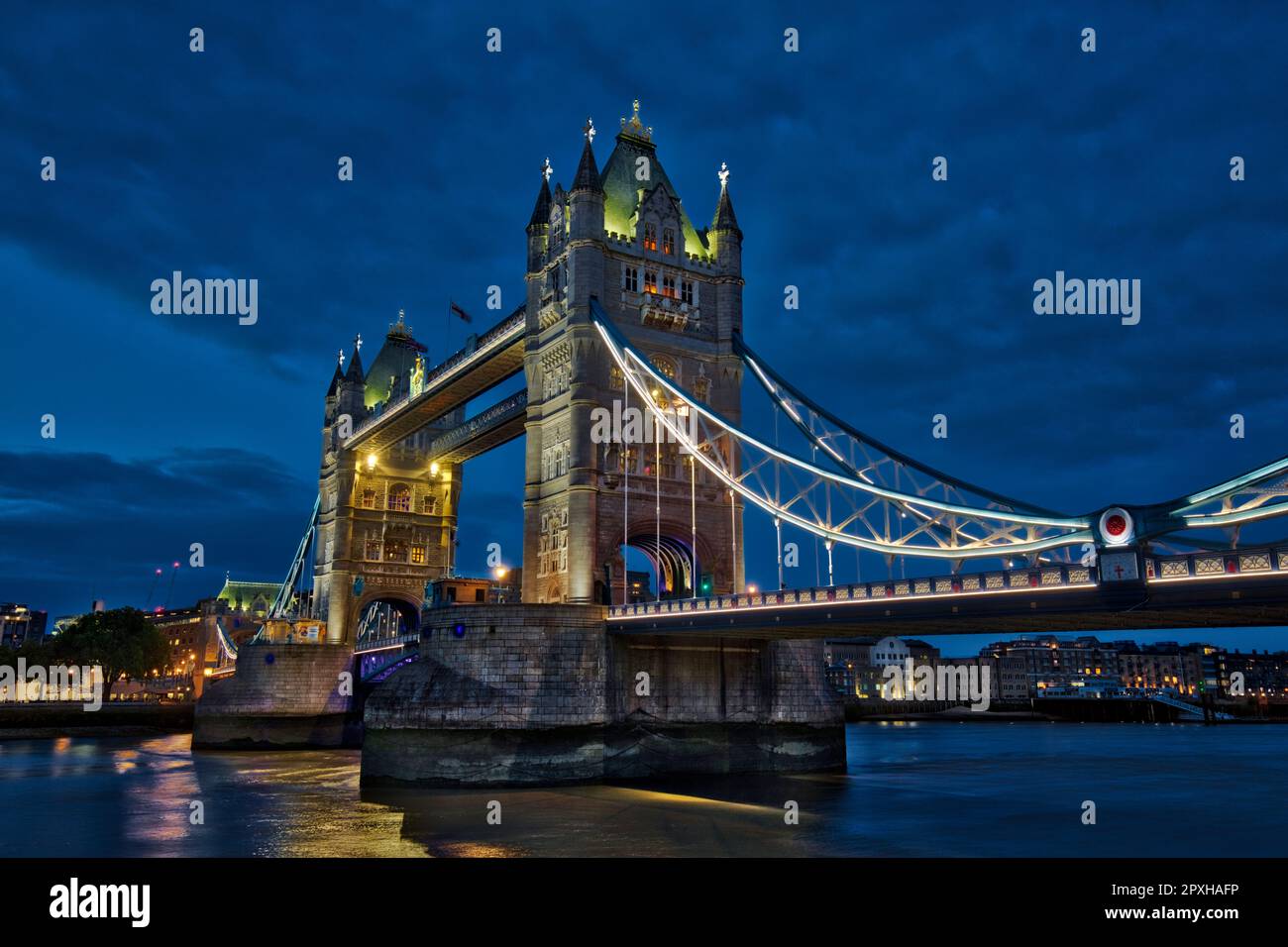 Tower Bridge over River Thames linking boroughs of Southwark and Tower Hamlets at twilight. Engineer John Wolfe Barry, design Horace Jones. London. Stock Photo