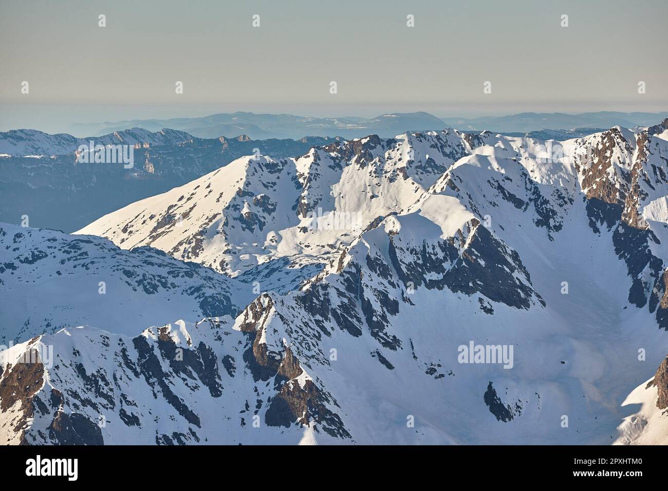 Winter high mountain landscape covered in clouds and snow Stock Photo ...