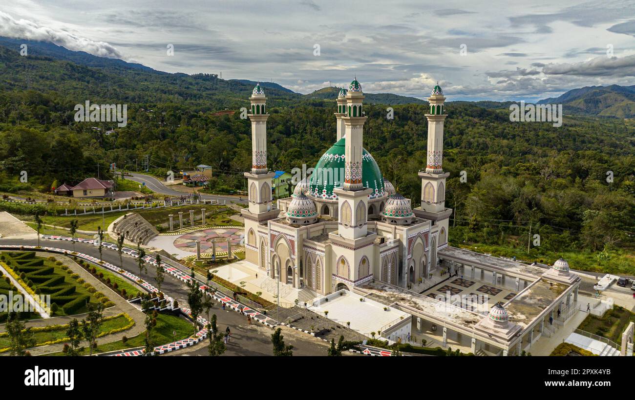 Aerial view of mosque in the background of the mountains. Masjid Agung Syahrun Nur Tapanuli Selatan. Indonesia. Stock Photo